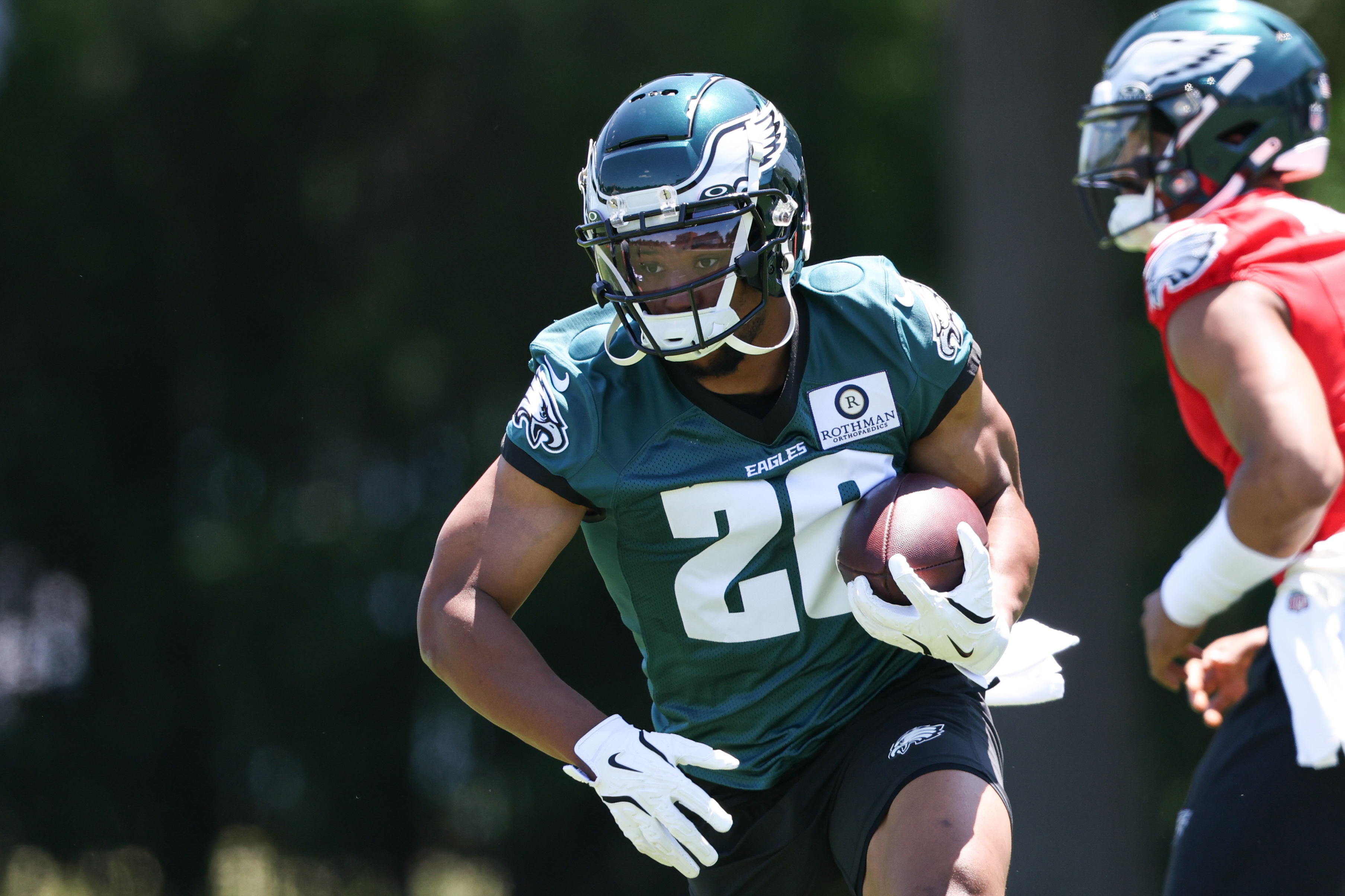 May 30, 2024; Philadelphia, PA, USA; Philadelphia Eagles running back Saquon Barkley (26) runs with the ball during practice at NovaCare Complex.