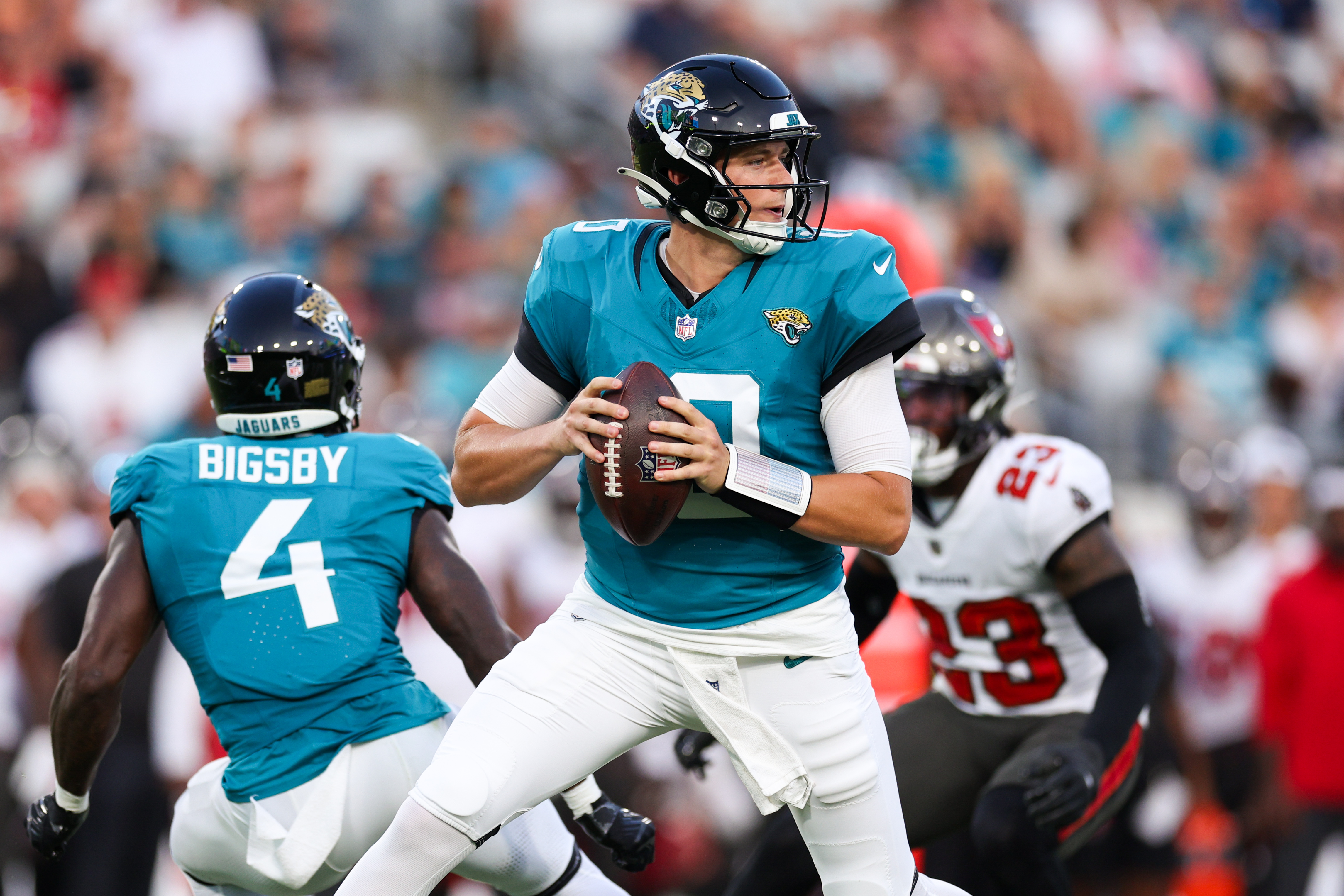 Aug 17, 2024; Jacksonville, Florida, USA; Jacksonville Jaguars quarterback Mac Jones (10) drops back to pass against the Tampa Bay Buccaneers in the first quarter during a preseason game at EverBank Stadium.