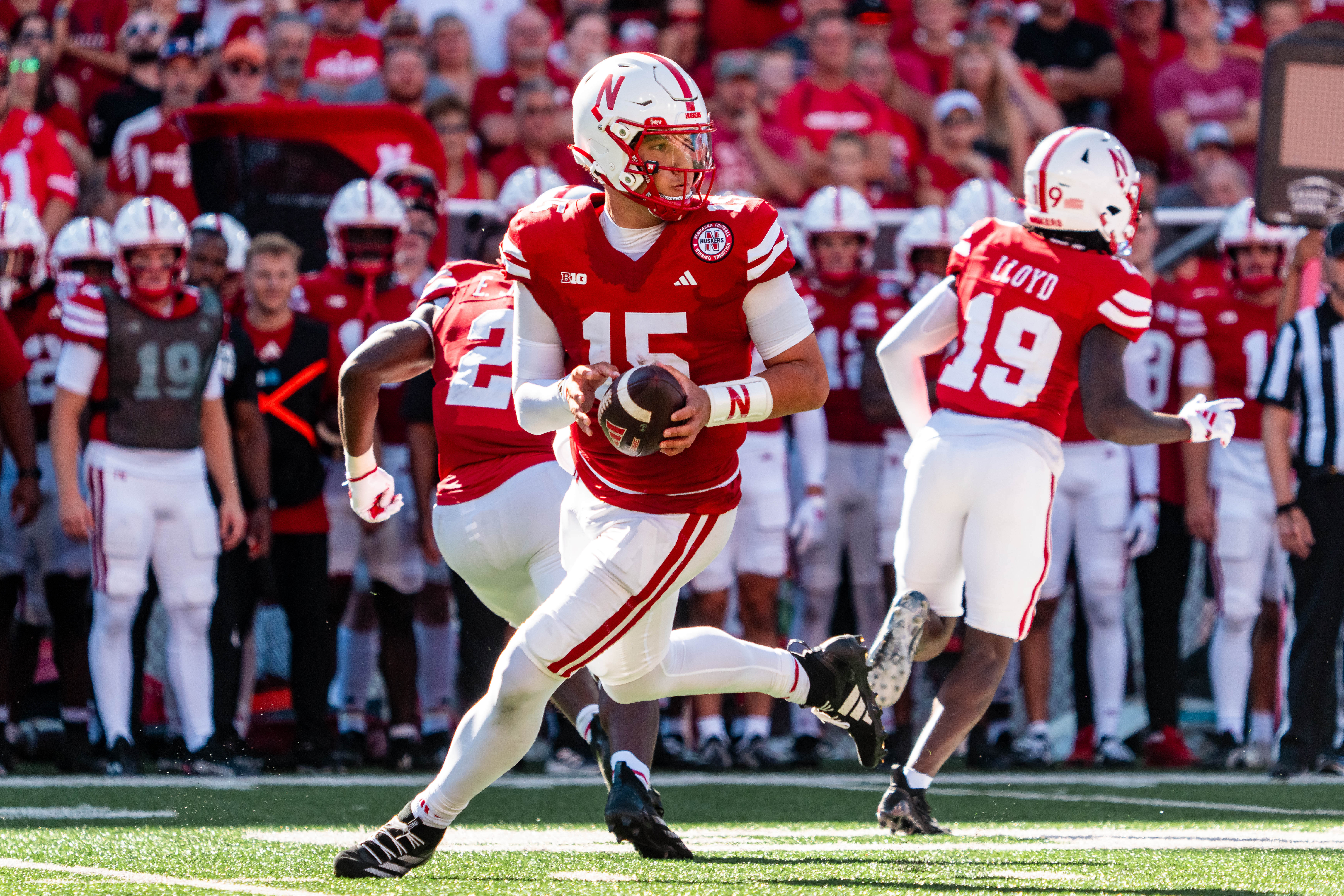 Aug 31, 2024; Lincoln, Nebraska, USA; Nebraska Cornhuskers quarterback Dylan Raiola (15) rolls out to pass against the UTEP Miners during the third quarter at Memorial Stadium.