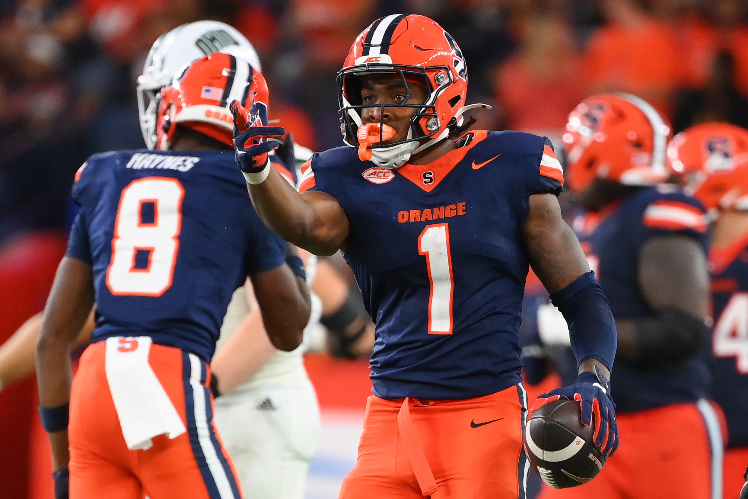 Aug 31, 2024; Syracuse, New York, USA; Syracuse Orange running back LeQuint Allen (1) gestures after a first down against the Ohio Bobcats during the second half at the JMA Wireless Dome.