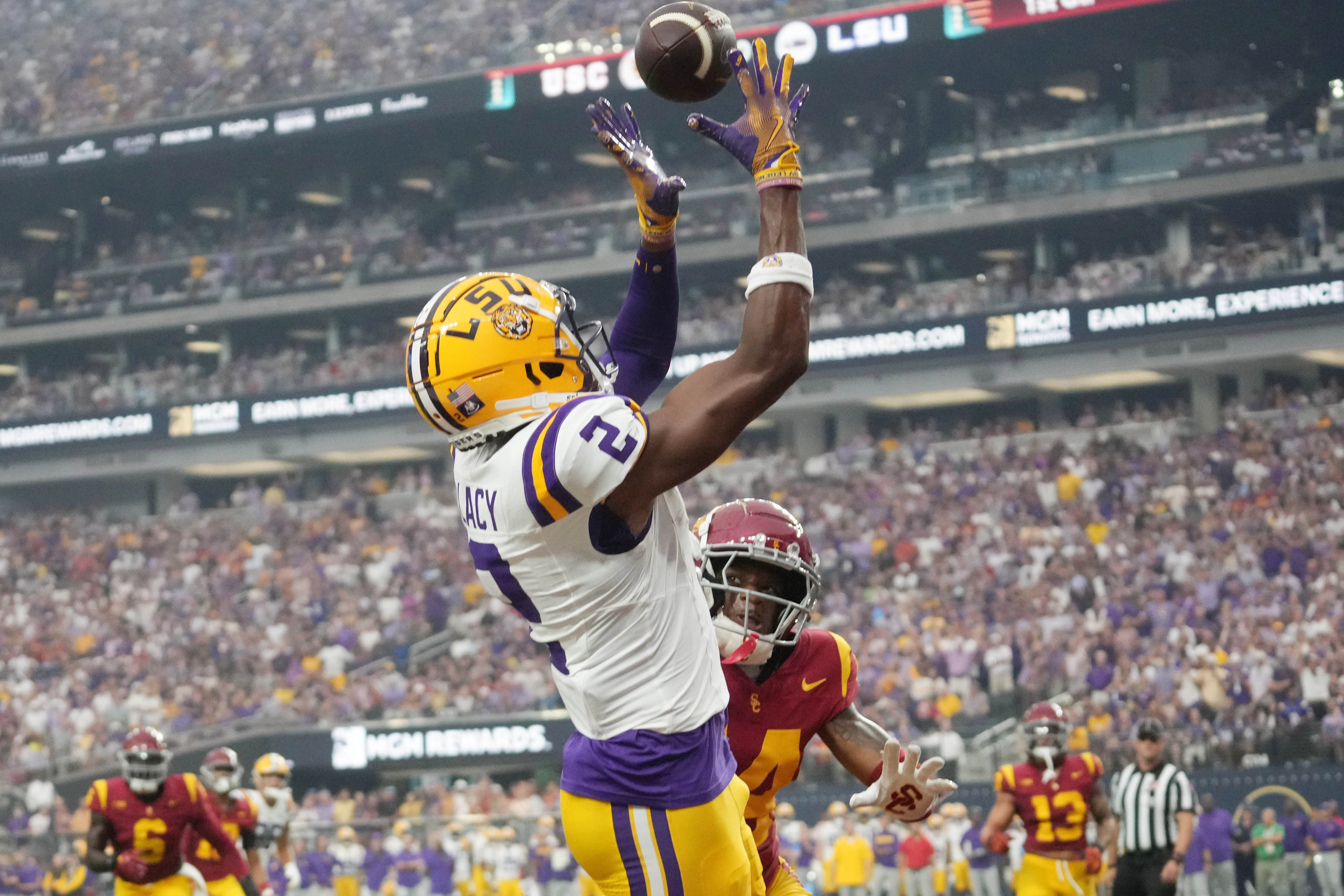 Sep 1, 2024; Paradise, Nevada, USA; LSU Tigers wide receiver Kyren Lacy (2) attempts to catch the ball against Southern California Trojans cornerback Jacobe Covington (14) at Allegiant Stadium.