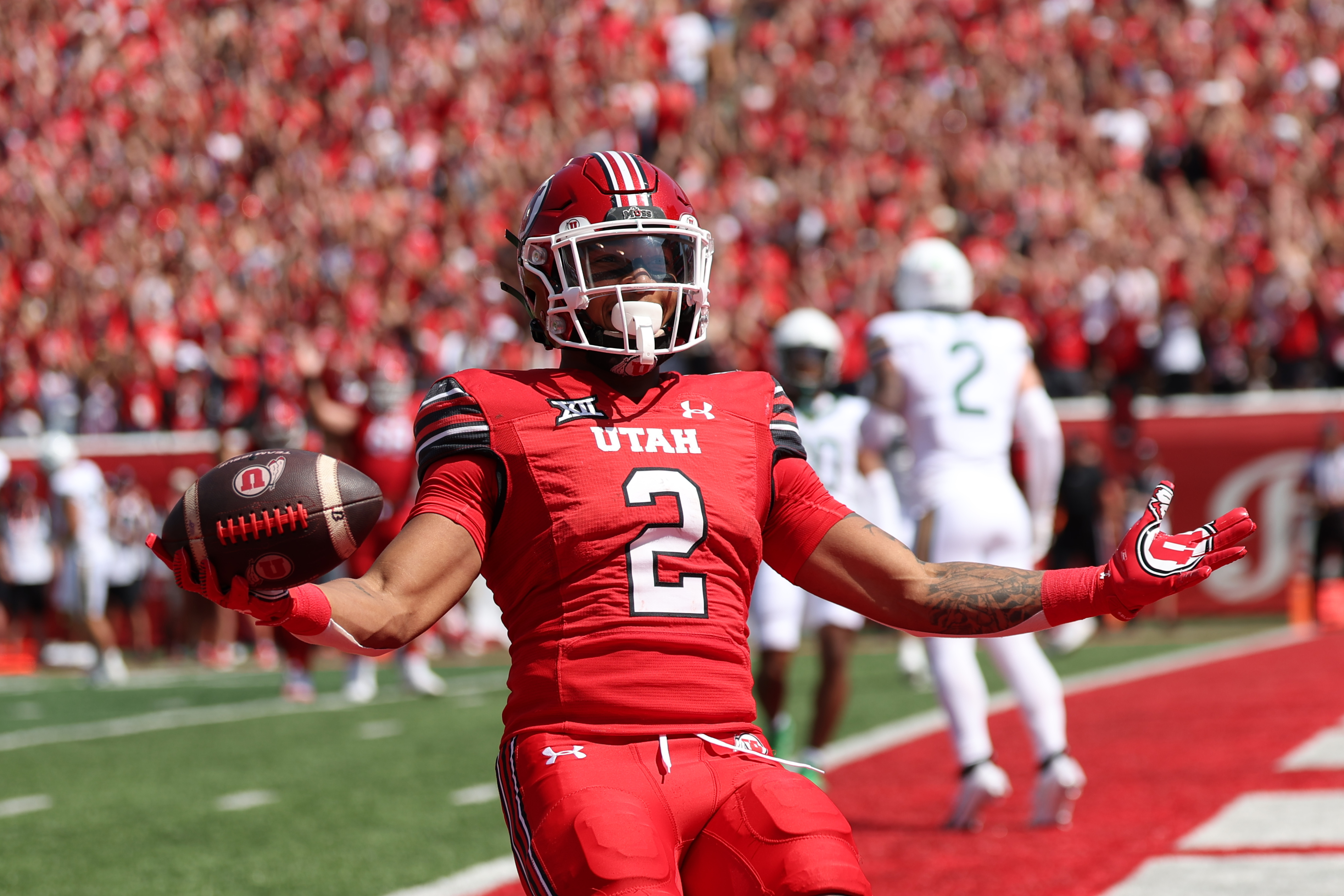 Sep 7, 2024; Salt Lake City, Utah, USA; Utah Utes running back Micah Bernard (2) celebrates a touchdown against the Baylor Bears during the first quarter at Rice-Eccles Stadium.