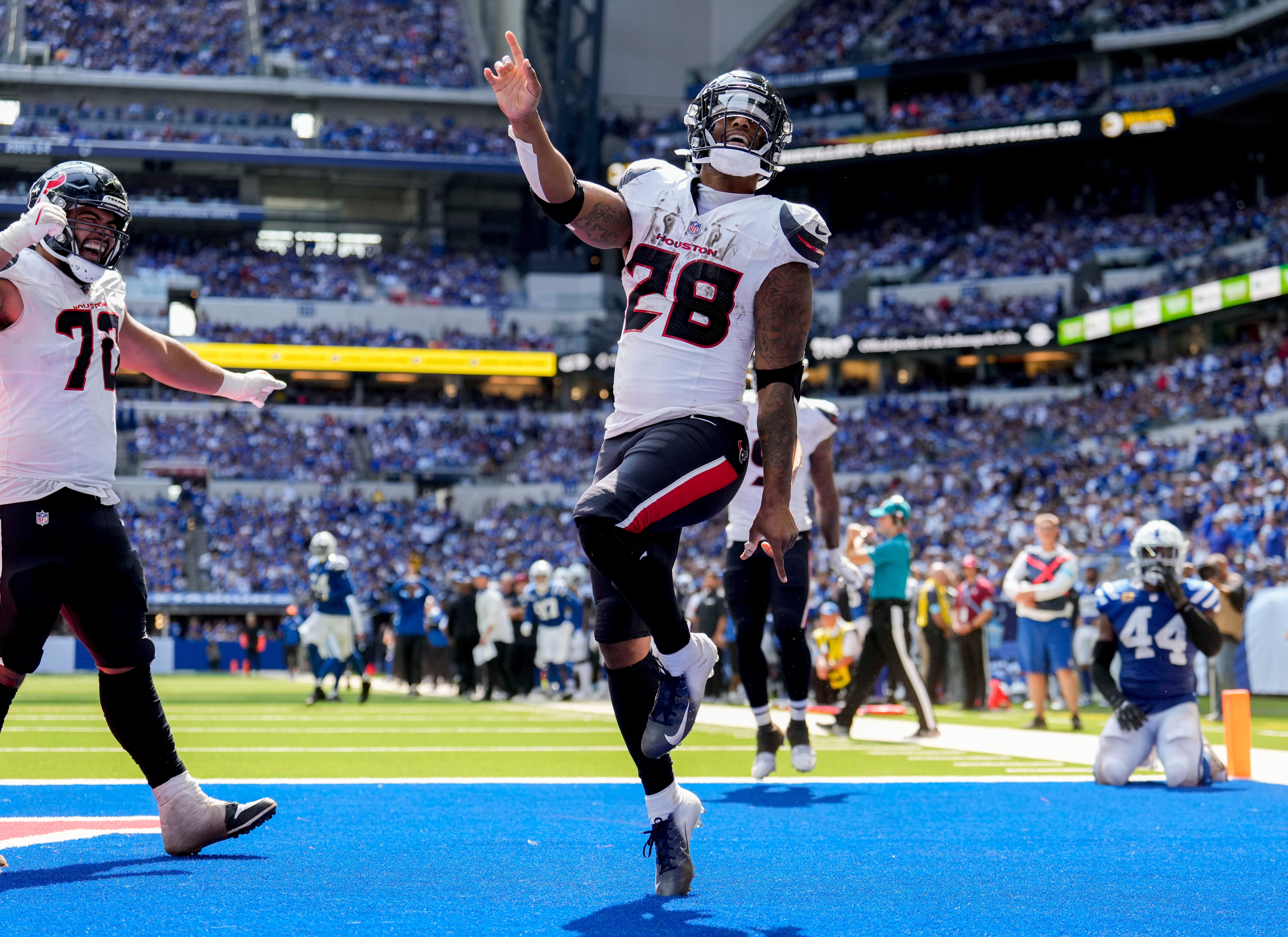 Houston Texans running back Joe Mixon (28) celebrates after scoring a touchdown Sunday, Sept. 8, 2024, during a game against the Indianapolis Colts at Lucas Oil Stadium in Indianapolis.