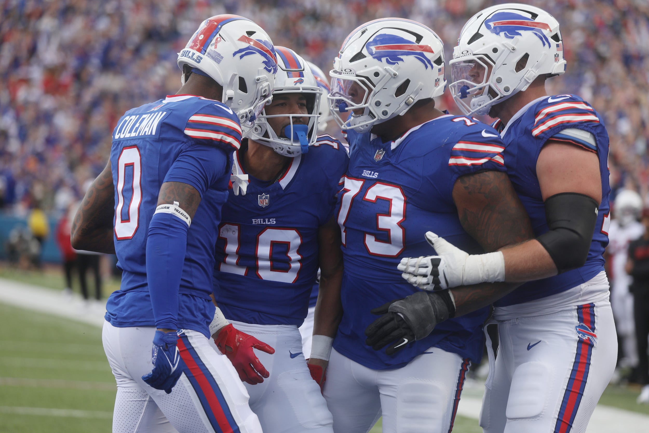 Bills Khalil Shakir is congratulated by teammates Keon Coleman, Dion Dawkins and Spencer Brown on his touchdown catch during the third quarter at Highmark Stadium in Orchard Park on Sept. 8, 2024.