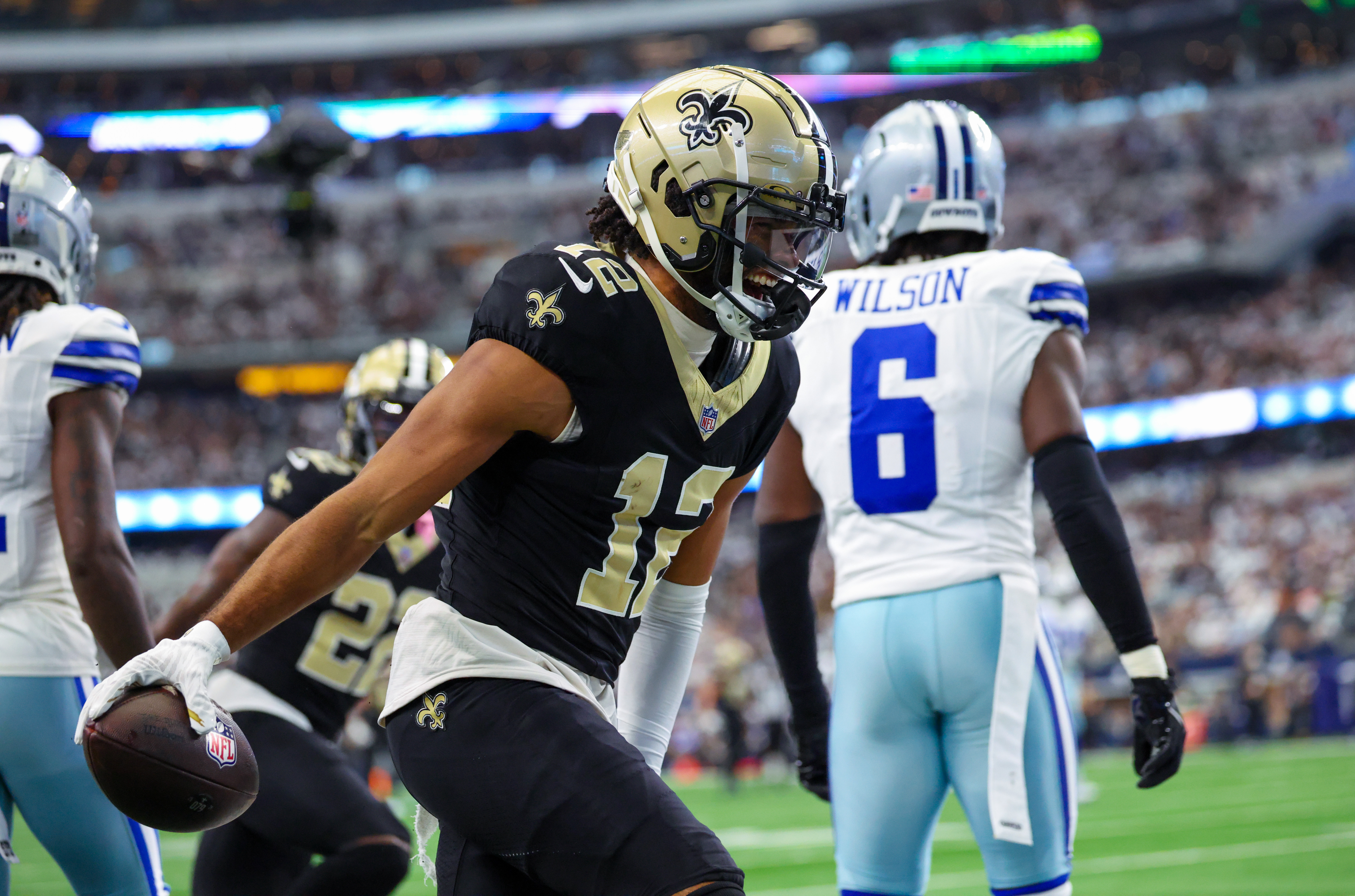 Sep 15, 2024; Arlington, Texas, USA; New Orleans Saints wide receiver Chris Olave (12) reacts during the first quarter against the Dallas Cowboys at AT&T Stadium.