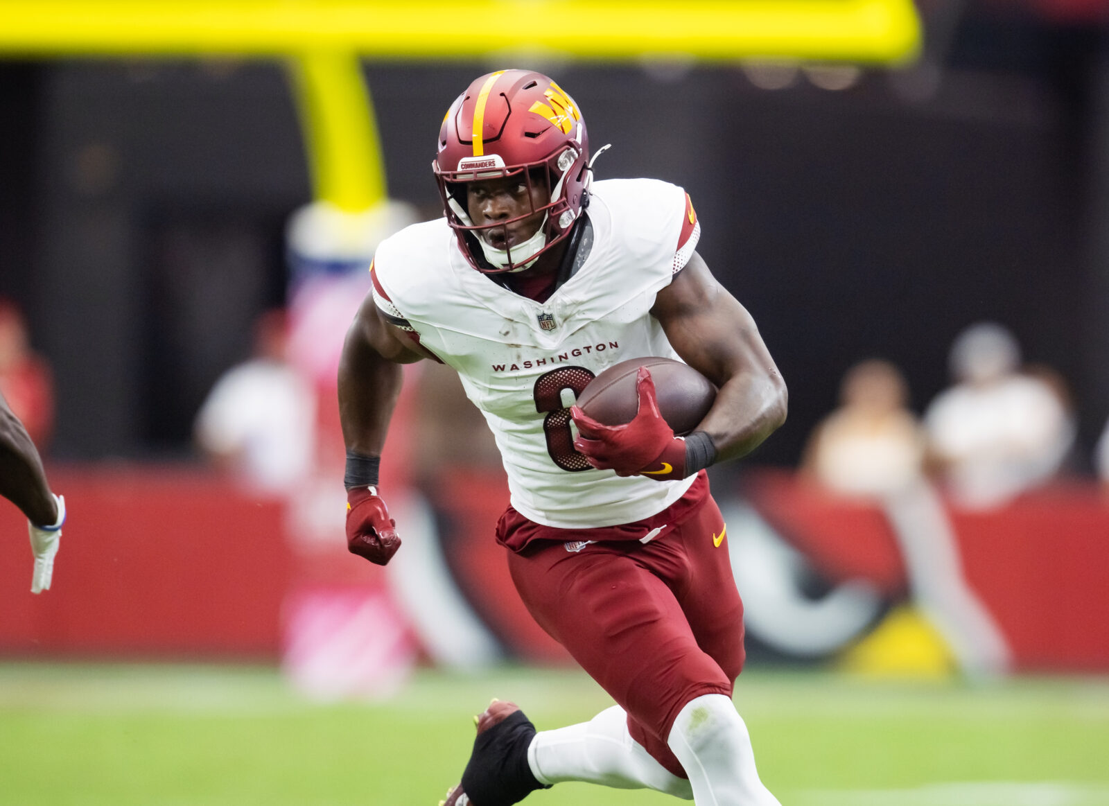 Sep 29, 2024; Glendale, Arizona, USA; Washington Commanders running back Brian Robinson Jr. (8) against the Arizona Cardinals at State Farm Stadium.