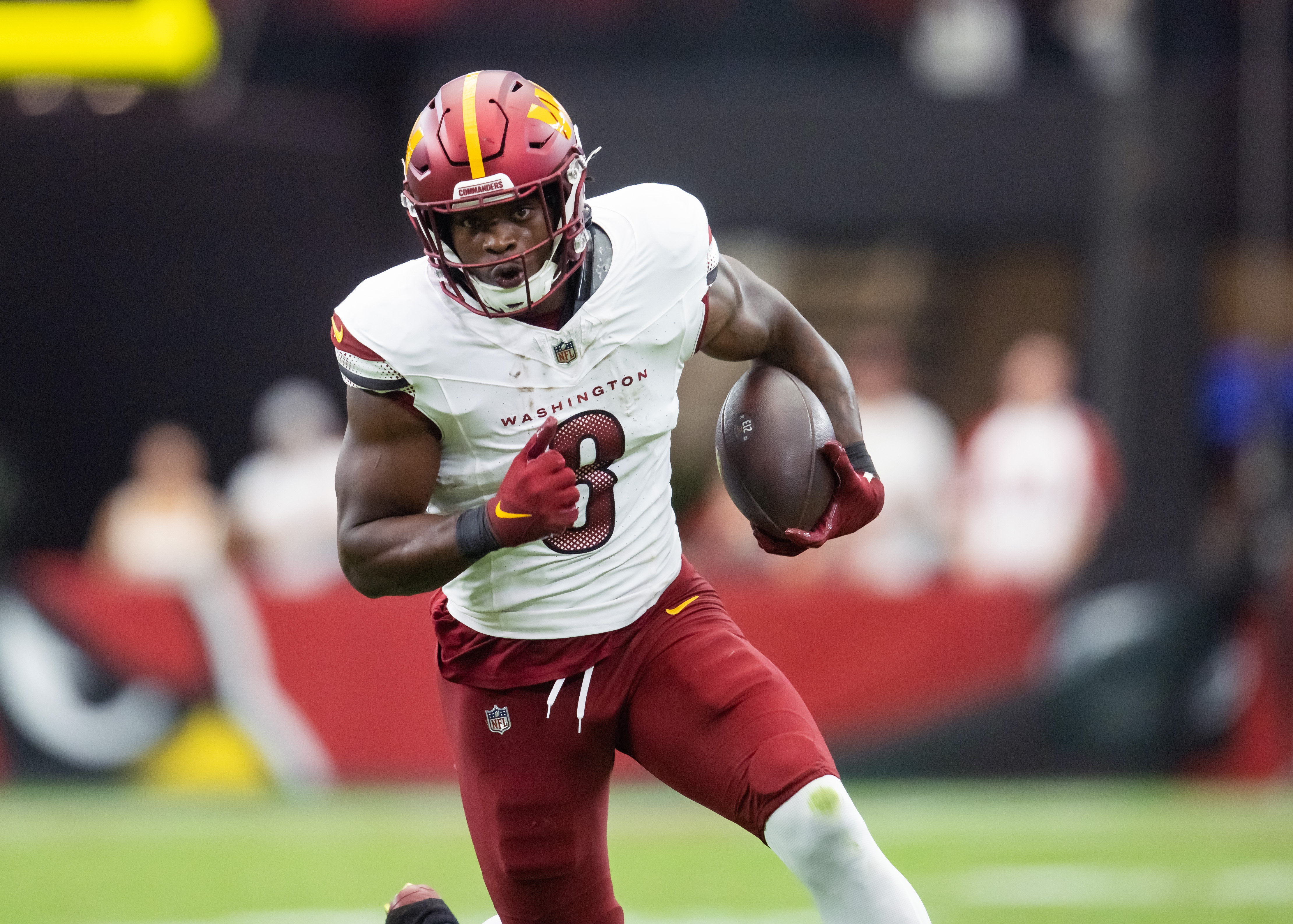 Sep 29, 2024; Glendale, Arizona, USA; Washington Commanders running back Brian Robinson Jr. (8) against the Arizona Cardinals at State Farm Stadium.