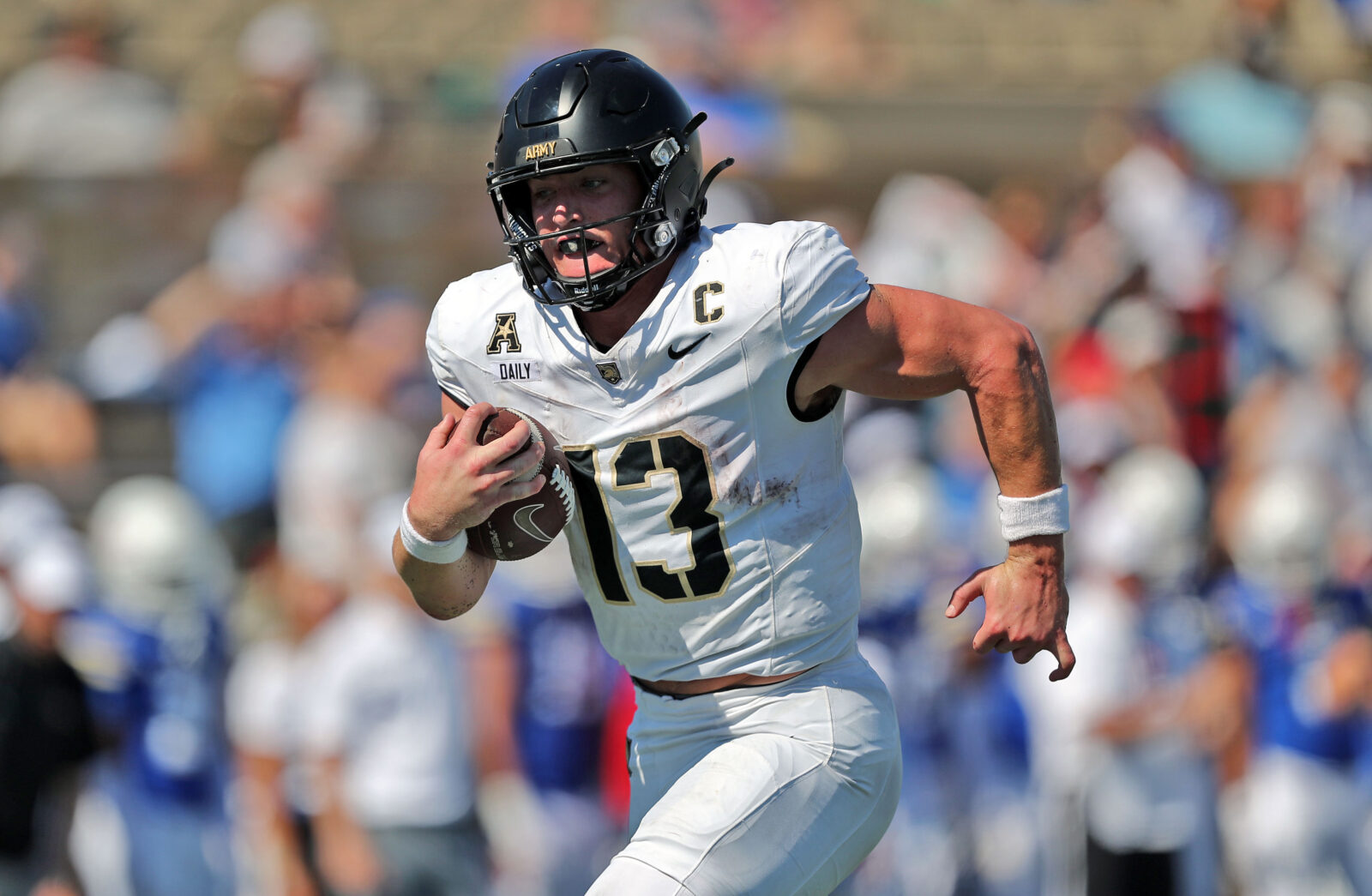 Oct 5, 2024; Tulsa, Oklahoma, USA; Army Black Knights quarterback Bryson Daily (13) runs for a touchdown against the Tulsa Golden Hurricane during the second half at Skelly Field at H.A. Chapman Stadium.