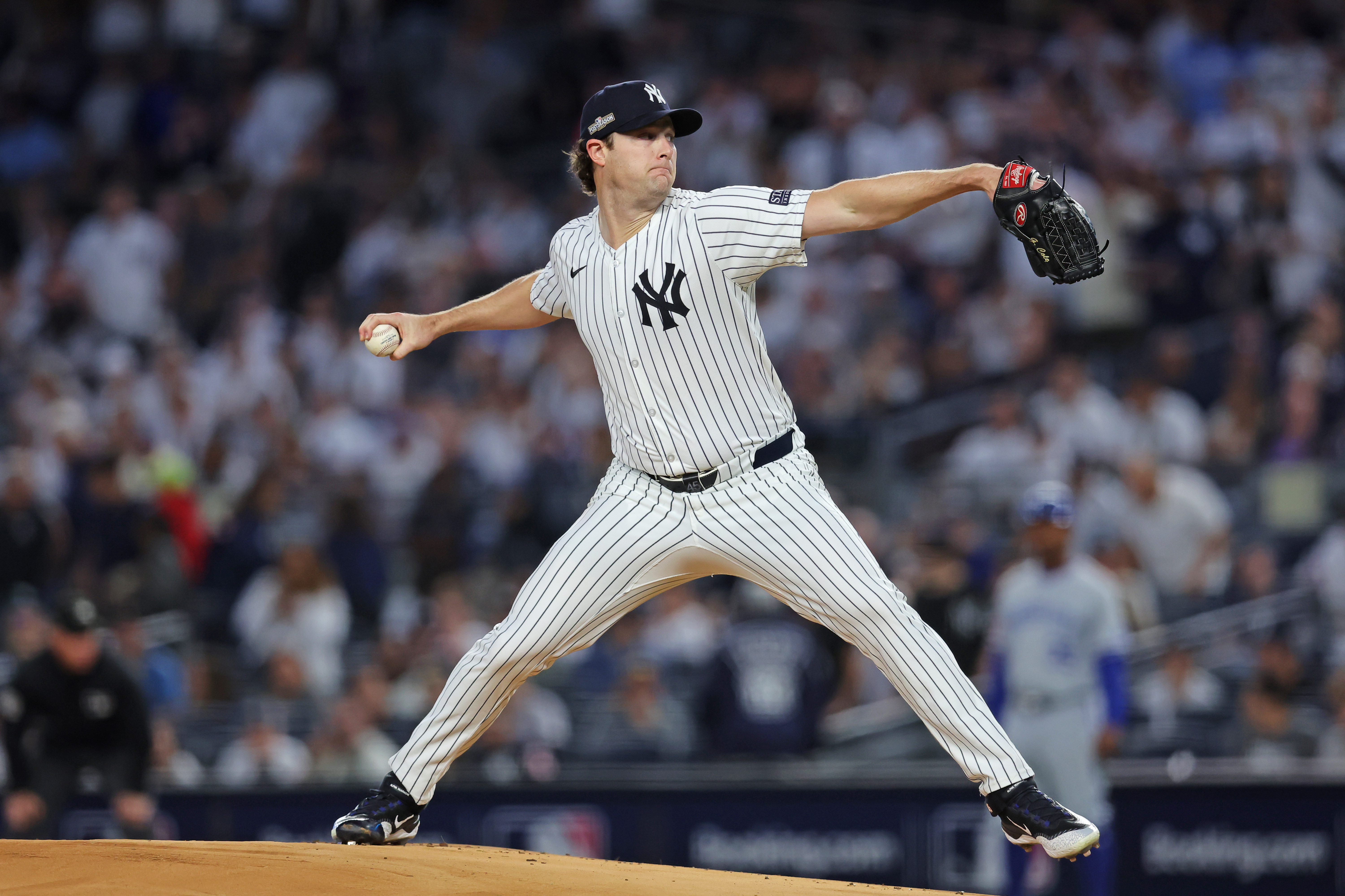 Oct 5, 2024; Bronx, New York, USA; New York Yankees pitcher Gerrit Cole (45) throws a pitch during the first inning against Kansas City Royals during game one of the ALDS for the 2024 MLB Playoffs at Yankee Stadium.