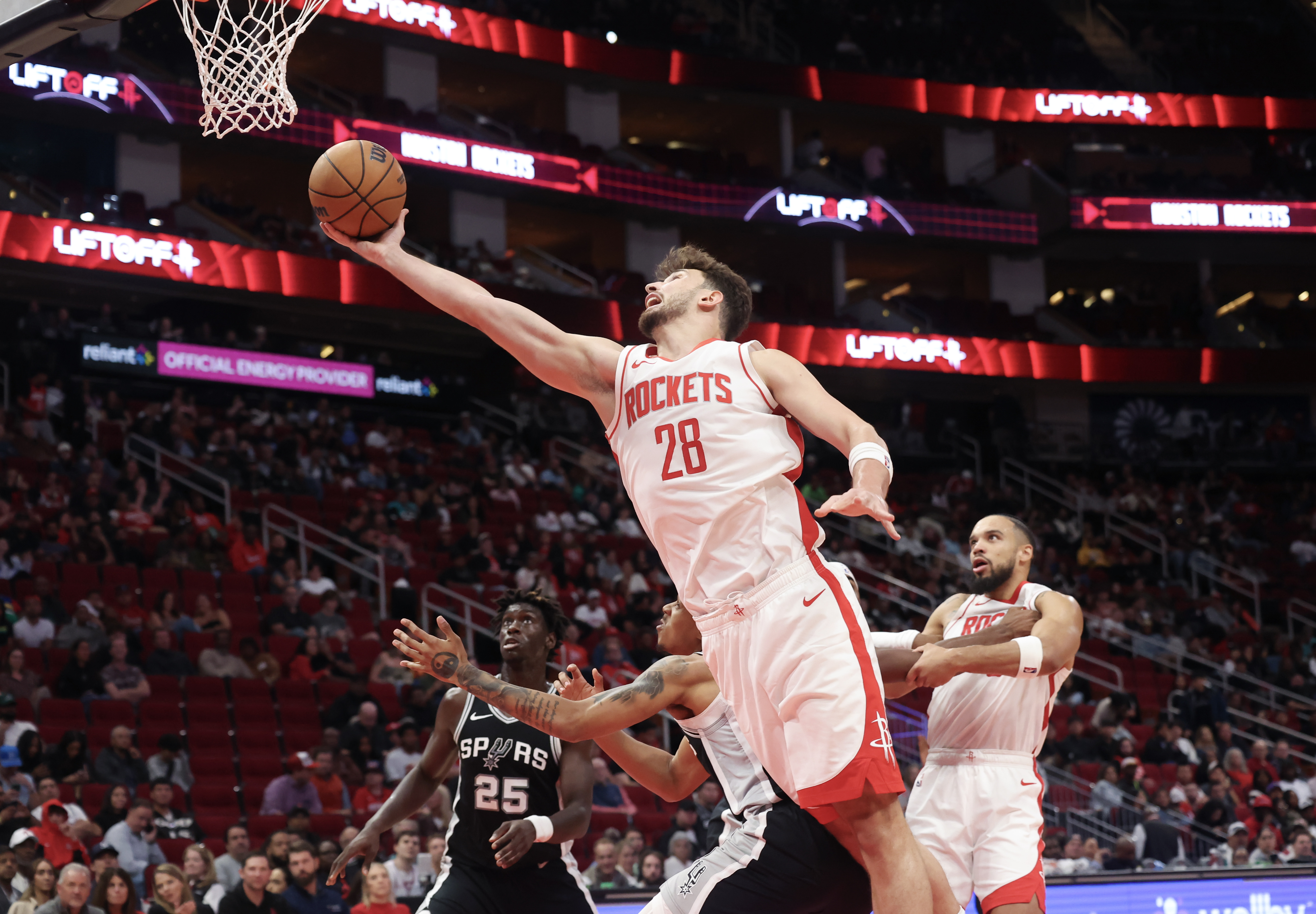 Oct 17, 2024; Houston, Texas, USA; Houston Rockets center Alperen Sengun (28) shoots against San Antonio Spurs guard Brandon Boston Jr. (4) in the fourth quarter at Toyota Center.