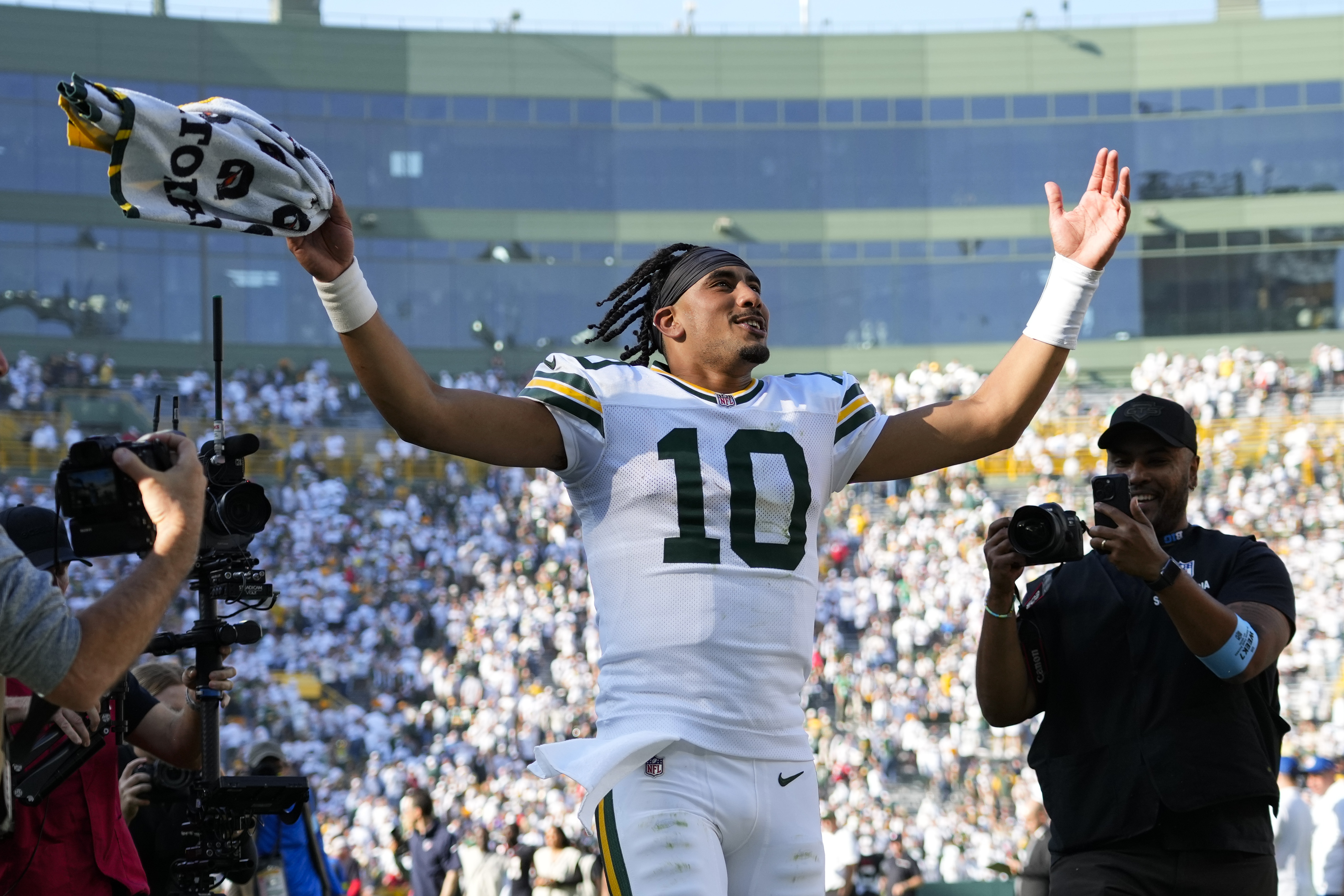 Oct 20, 2024; Green Bay, Wisconsin, USA; Green Bay Packers quarterback Jordan Love (10) celebrates as he runs off the field following the game against the Houston Texans at Lambeau Field.