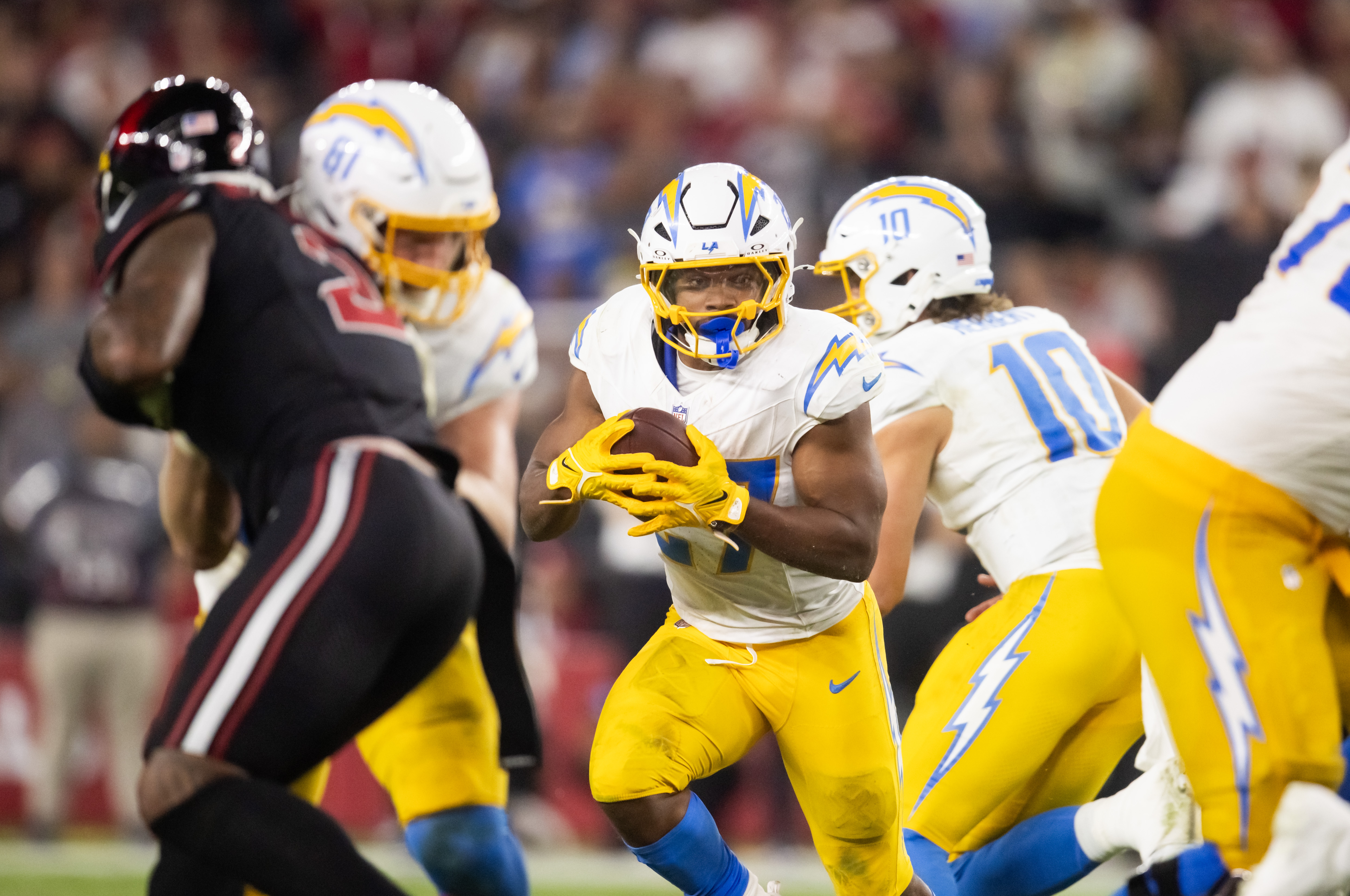 Oct 21, 2024; Glendale, Arizona, USA; Los Angeles Chargers running back J.K. Dobbins (27) against the Arizona Cardinals at State Farm Stadium.