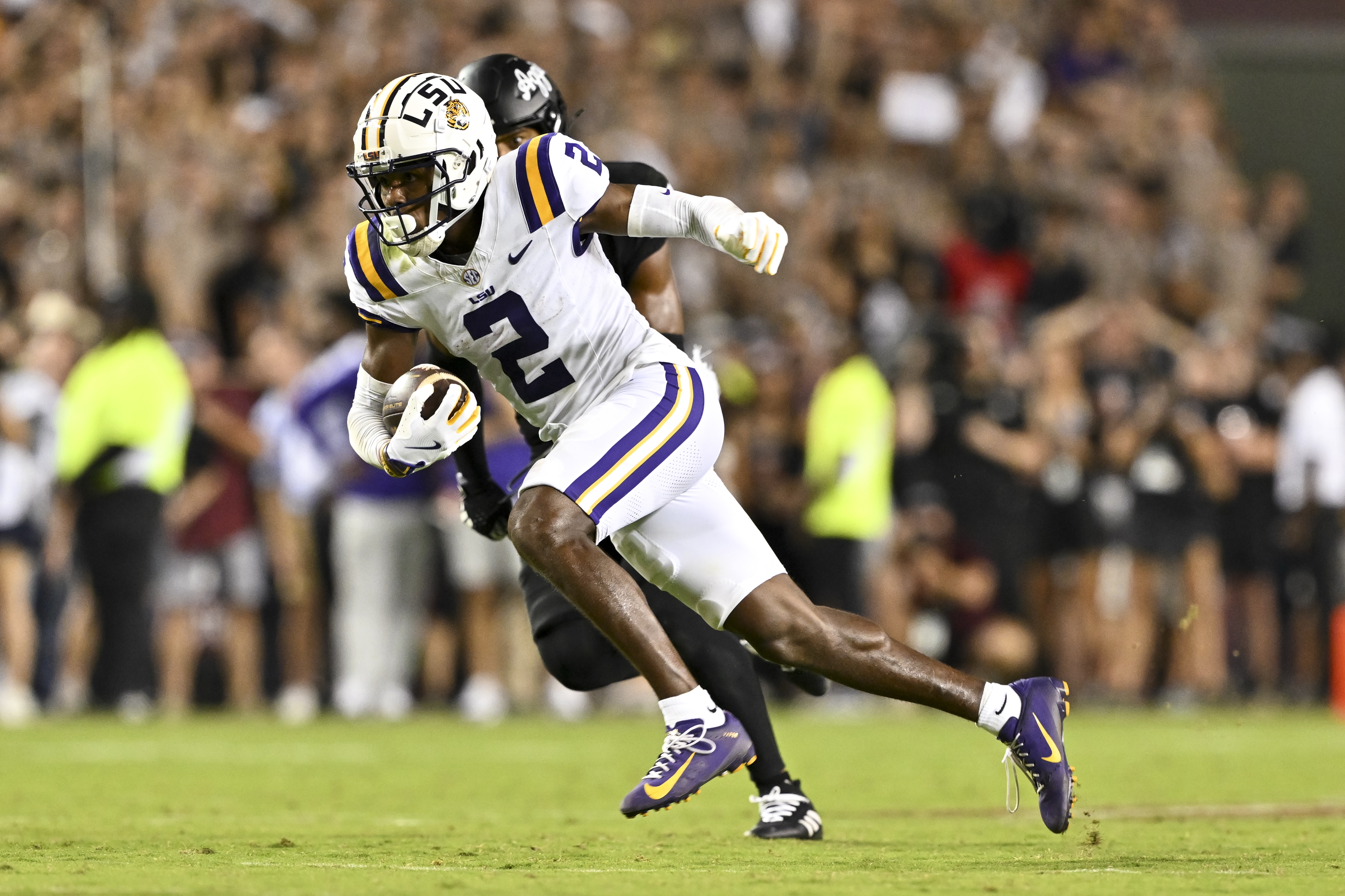 Oct 26, 2024; College Station, Texas, USA; LSU Tigers wide receiver Kyren Lacy (2) runs the ball against the Texas A&M Aggies during the second half. The Aggies defeated the Tigers 38-23; at Kyle Field.