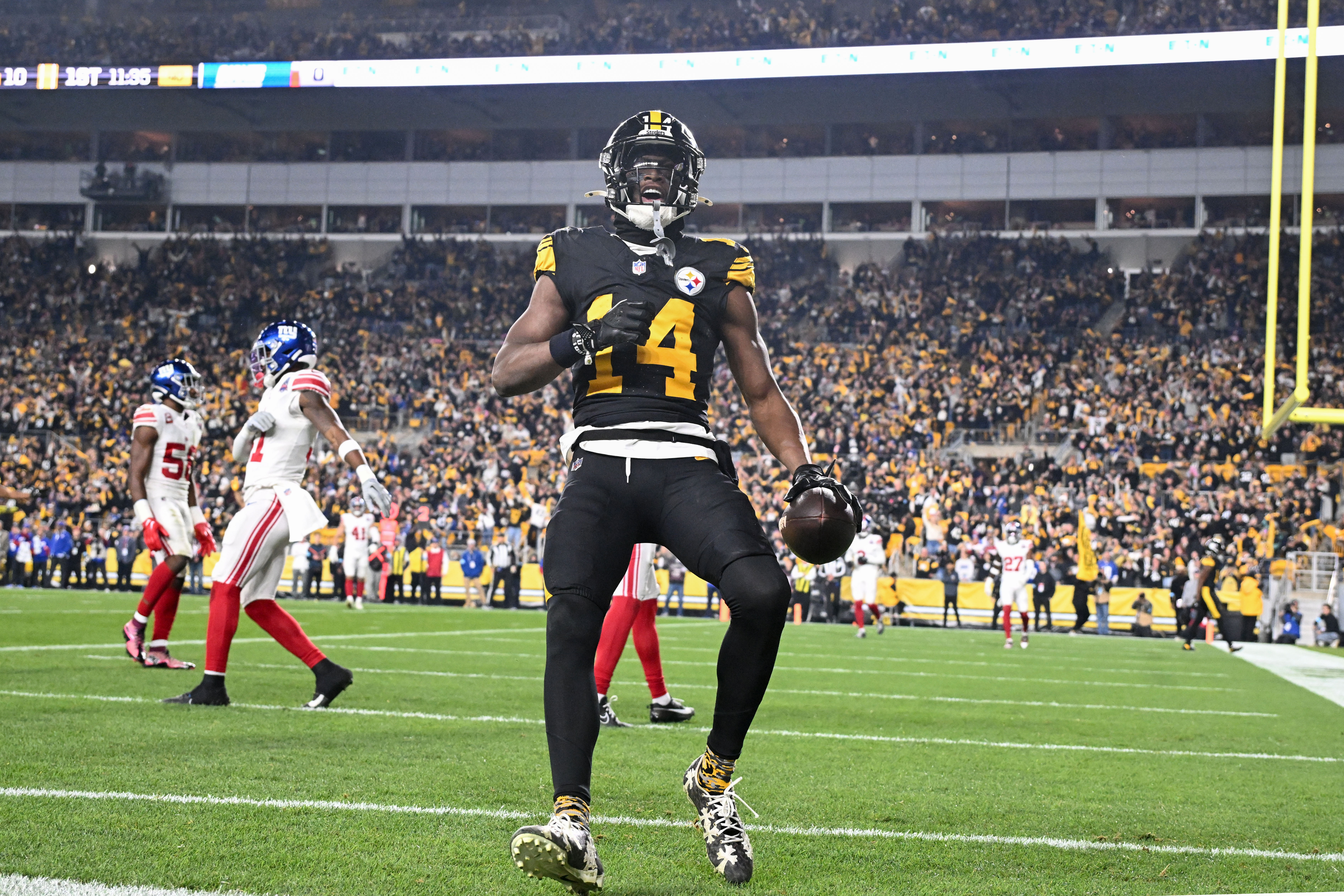 Oct 28, 2024; Pittsburgh, Pennsylvania, USA; Pittsburgh Steelers wide receiver George Pickens (14) celebrates a touchdown pass that was called back for a penalty against the New York Giants during the first half at Acrisure Stadium.