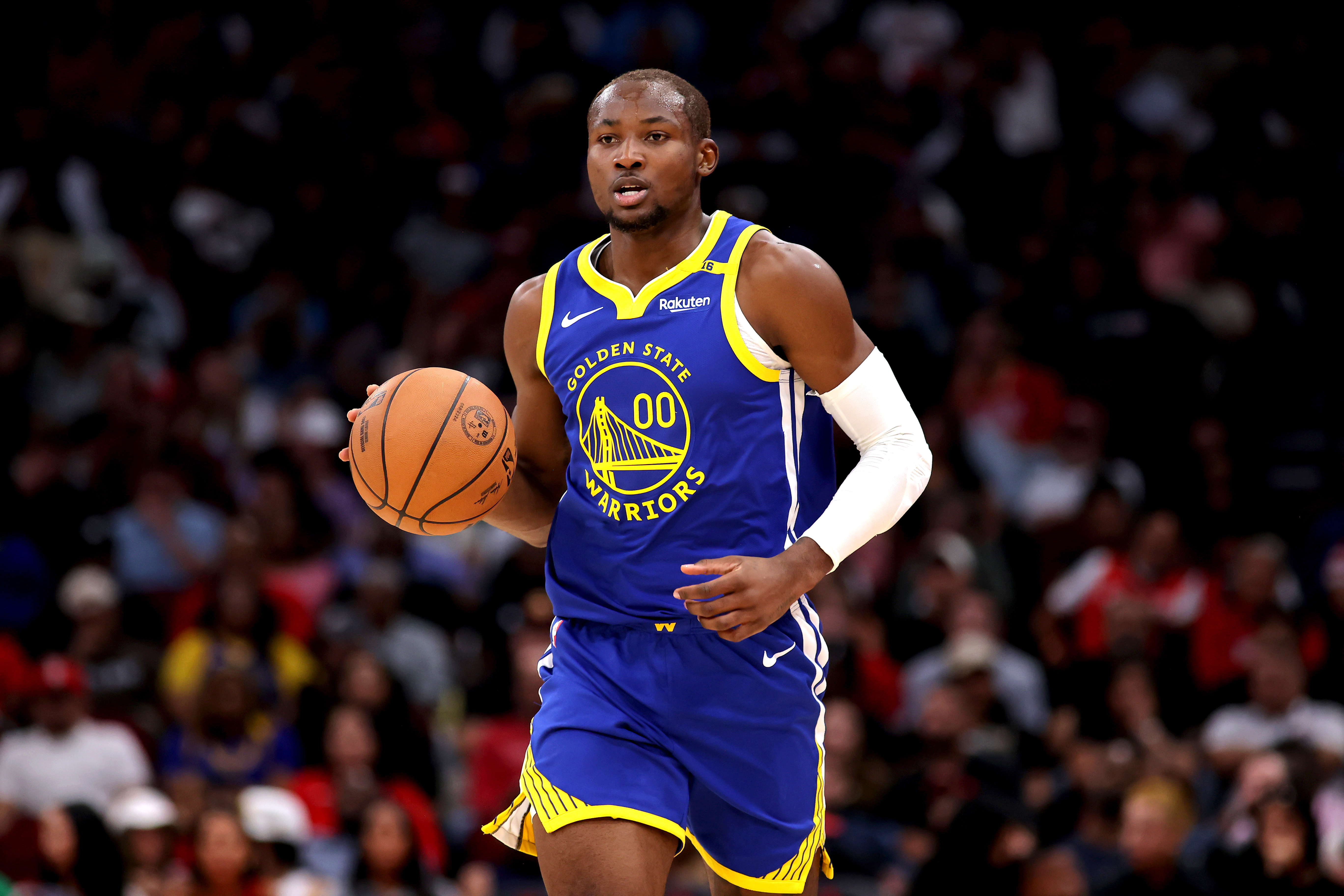 Nov 2, 2024; Houston, Texas, USA; Golden State Warriors forward Jonathan Kuminga (00) handles the ball against the Houston Rockets during the second quarter at Toyota Center.