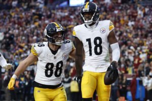 Nov 10, 2024; Landover, Maryland, USA; Pittsburgh Steelers wide receiver Mike Williams (18) celebrates with Steelers tight end Pat Freiermuth (88) after catching a touchdown pass against the Washington Commanders late in the second half at Northwest Stadium.