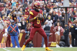 Nov 10, 2024; Landover, Maryland, USA; Washington Commanders quarterback Jayden Daniels (5) prepares to throw the ball against the Pittsburgh Steelers during the first half at Northwest Stadium.