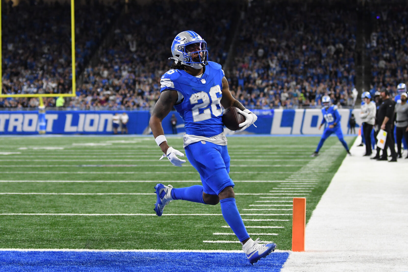 Nov 17, 2024; Detroit, Michigan, USA; Detroit Lions running back Jahmyr Gibbs (26) runs for a touchdown against the Jacksonville Jaguars in the second quarter at Ford Field.