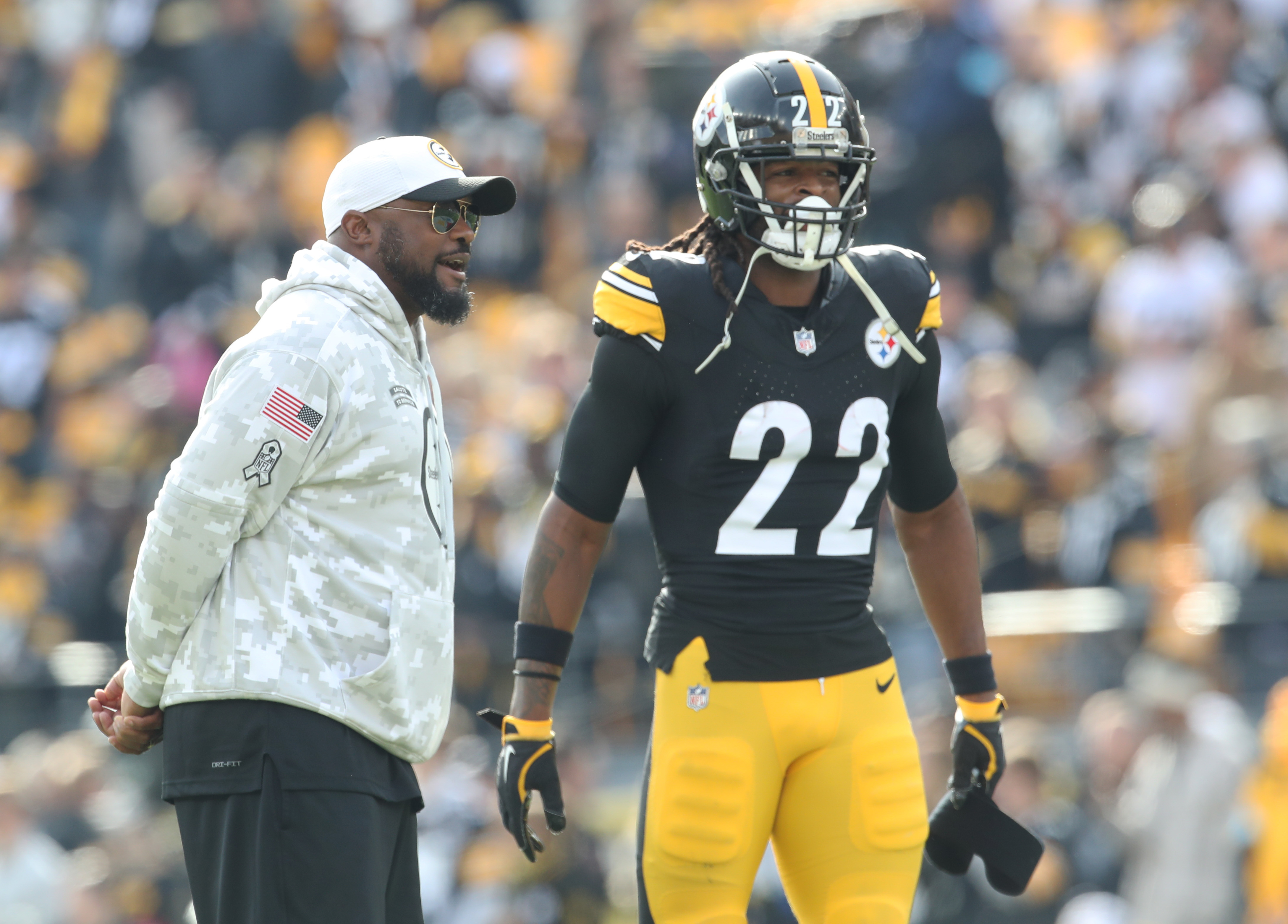 Nov 17, 2024; Pittsburgh, Pennsylvania, USA; Pittsburgh Steelers head coach Mike Tomlin (left) and running back Najee Harris (22) talk during warm ups before the game against the Baltimore Ravens at Acrisure Stadium.