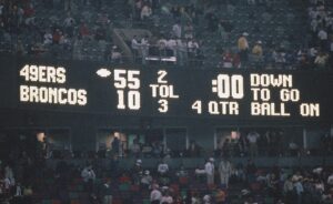 A scoreboard at the Superdome displays the 55-10 final score of Super Bowl XXIV between the San Francisco 49ers and the Denver Broncos